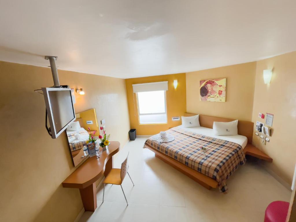 Postel nebo postele na pokoji v ubytování Auto Hotel Mediterráneo