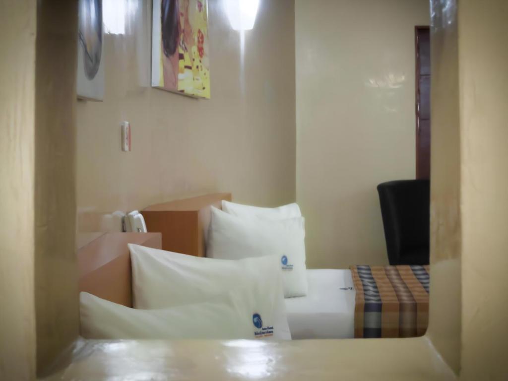 Postel nebo postele na pokoji v ubytování Auto Hotel Mediterráneo