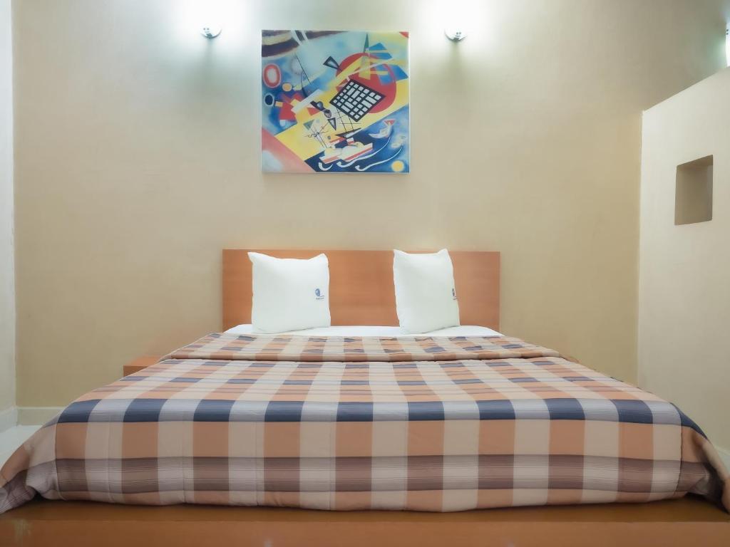 Postel nebo postele na pokoji v ubytování Auto Hotel Mediterráneo