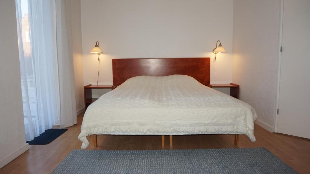 Postel nebo postele na pokoji v ubytování Børglum Mejeri Hotel