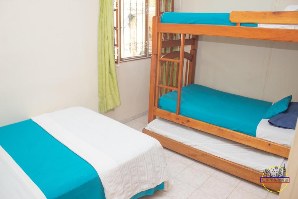 Postel nebo postele na pokoji v ubytování Hotel Finca Londres