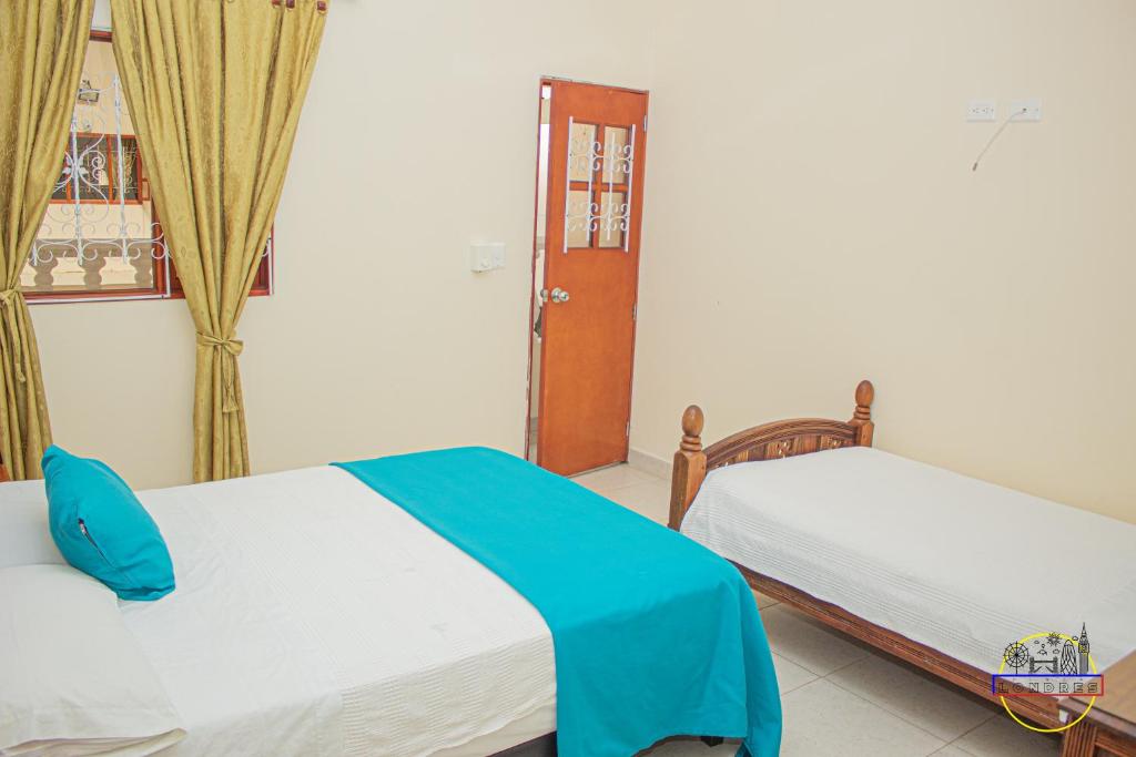 Postel nebo postele na pokoji v ubytování Hotel Finca Londres