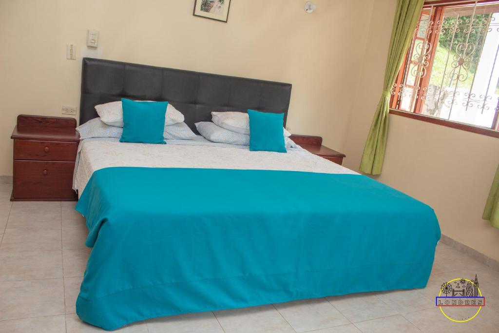 Postel nebo postele na pokoji v ubytování Hotel Finca Londres