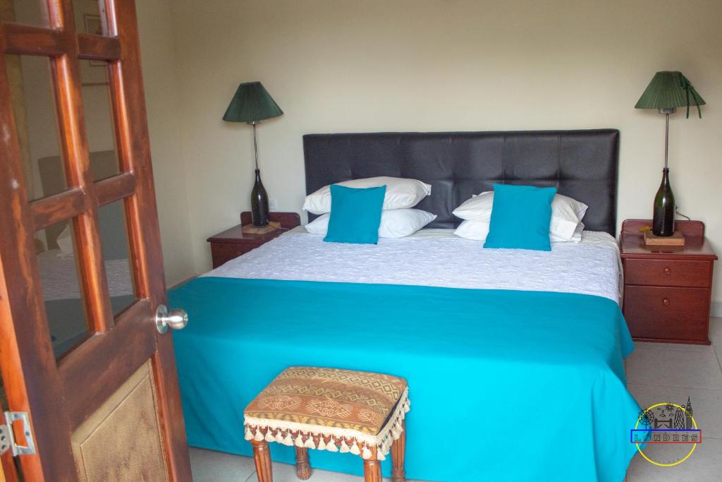 Postel nebo postele na pokoji v ubytování Hotel Finca Londres