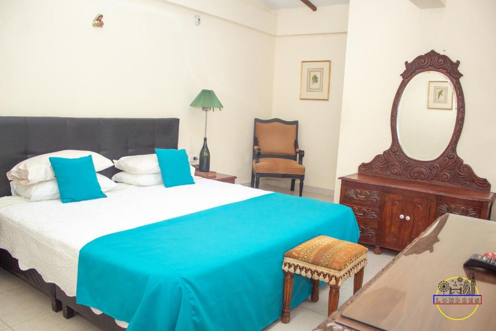 Postel nebo postele na pokoji v ubytování Hotel Finca Londres