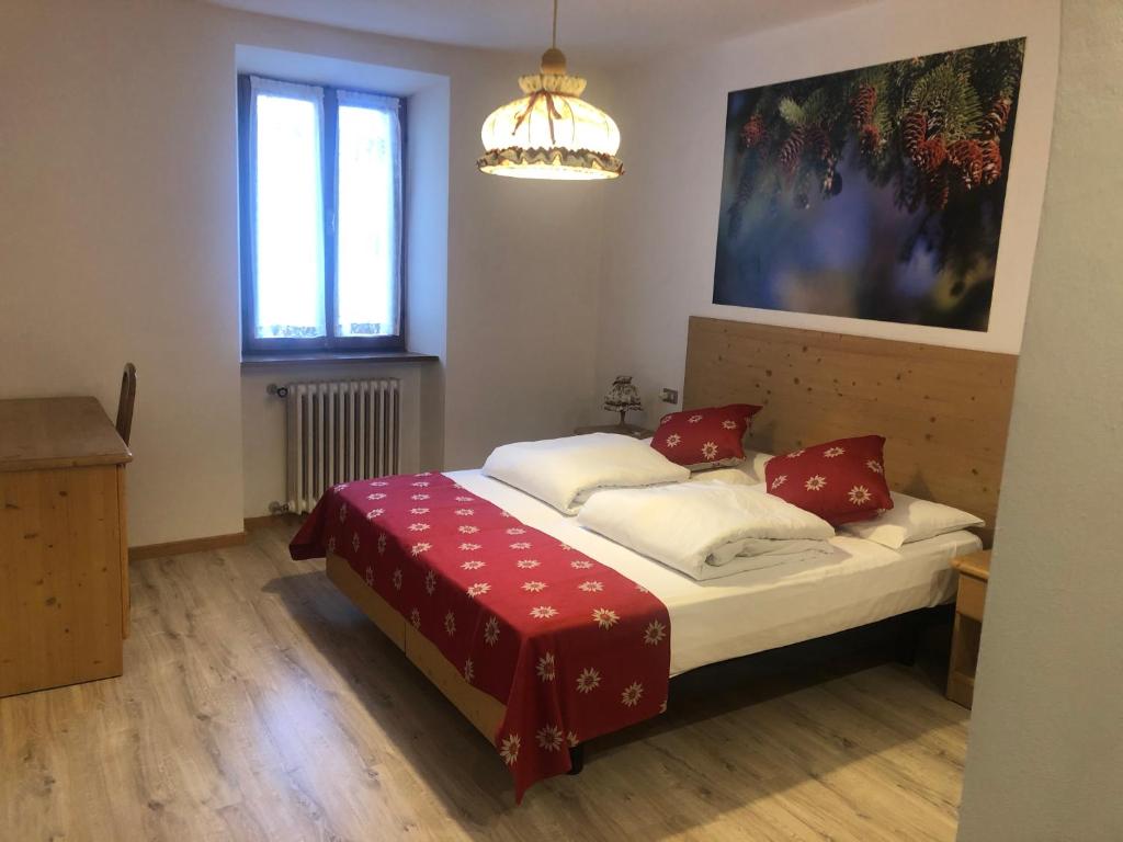 Postel nebo postele na pokoji v ubytování Hotel Bertoldi