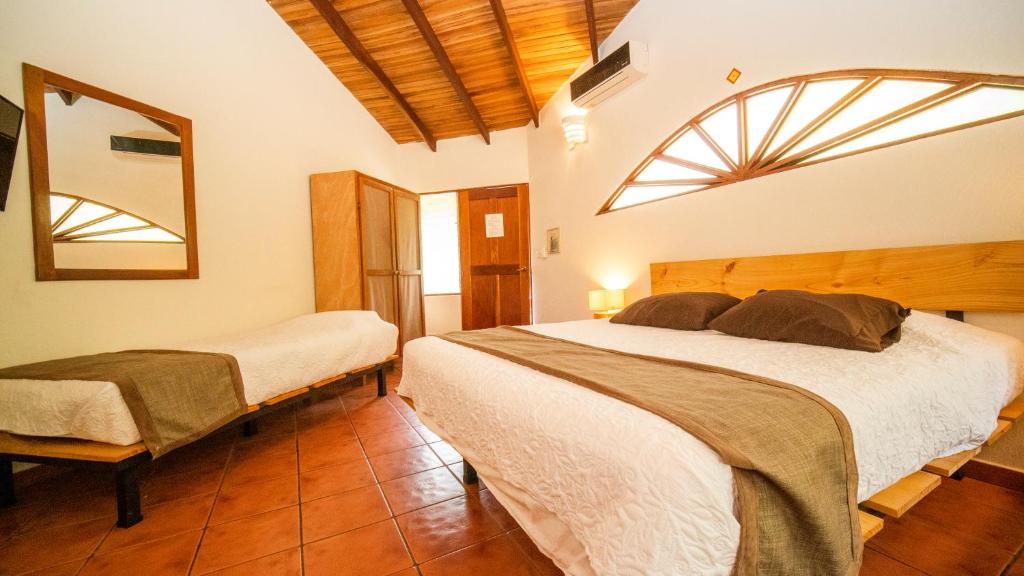 Postel nebo postele na pokoji v ubytování Hotel Luna Llena