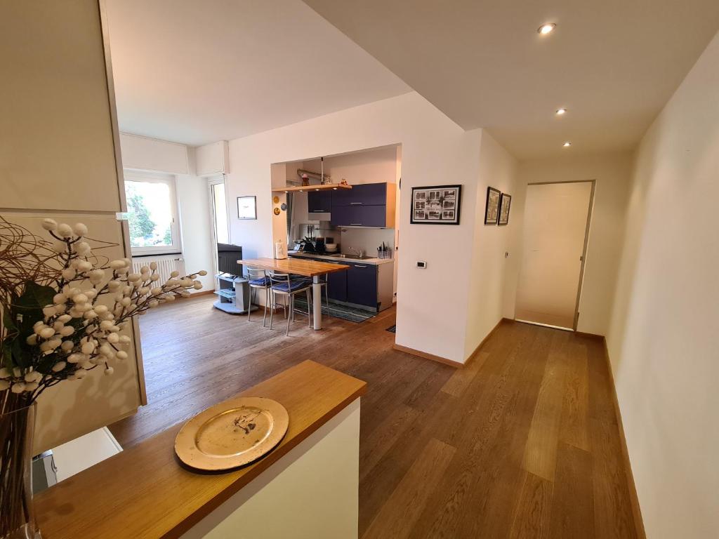 a kitchen and a living room with a table at La Casa di Riki by PortofinoVacanze in Rapallo