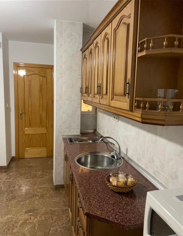 Kuchyň nebo kuchyňský kout v ubytování Apartamentos Coronichi