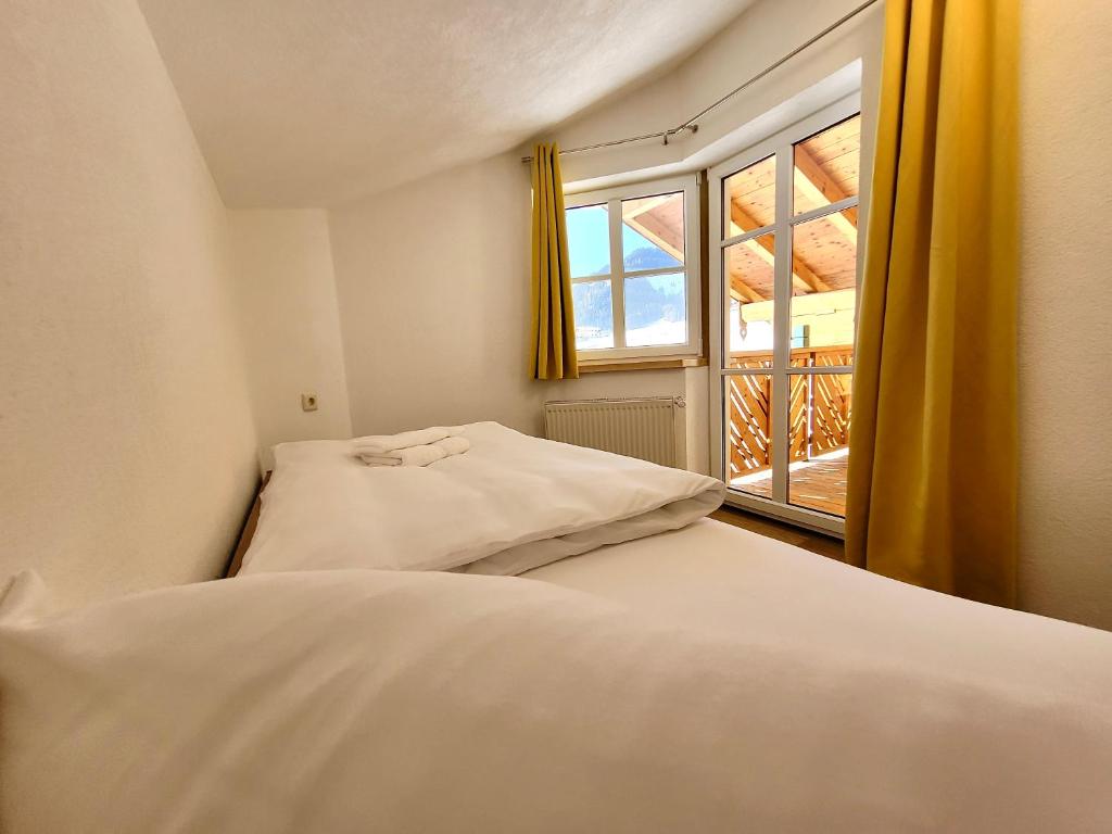 Posteľ alebo postele v izbe v ubytovaní Ferienwohnung Flachau Oberlehengut