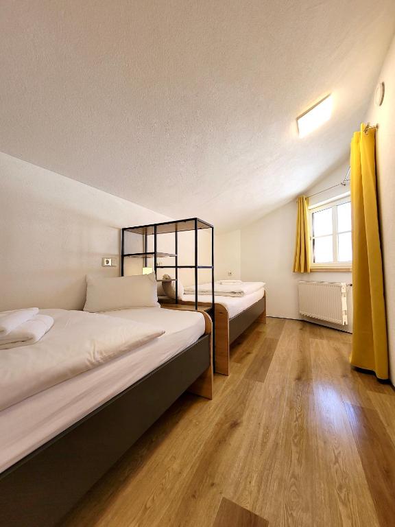 Posteľ alebo postele v izbe v ubytovaní Ferienwohnung Flachau Oberlehengut