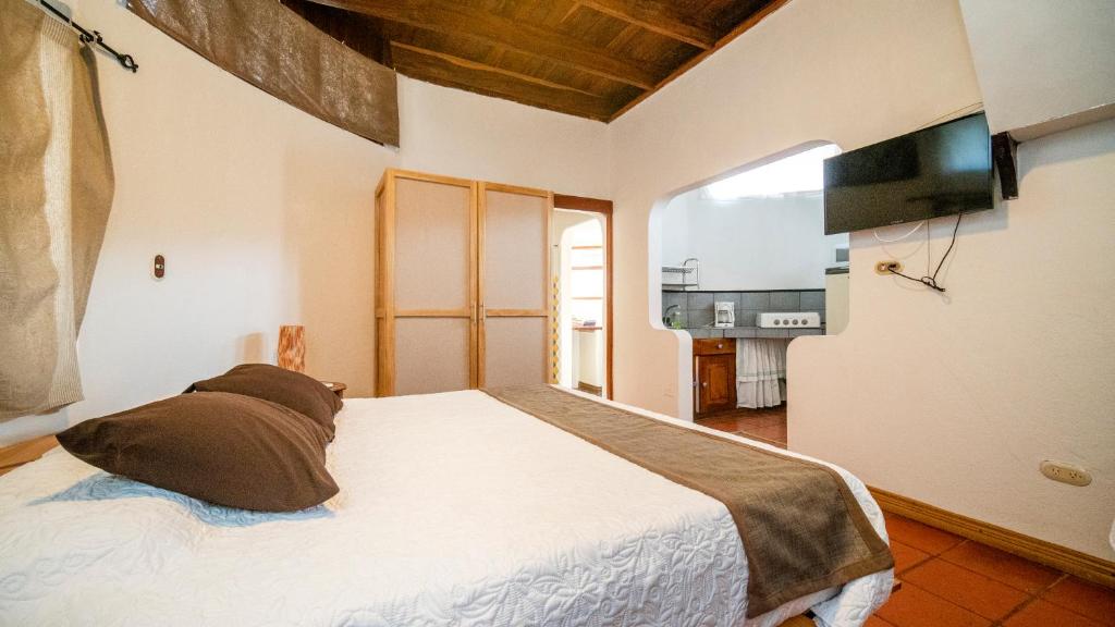 Postel nebo postele na pokoji v ubytování Hotel Luna Llena