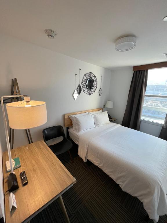 Posteľ alebo postele v izbe v ubytovaní Hotel Mimosa