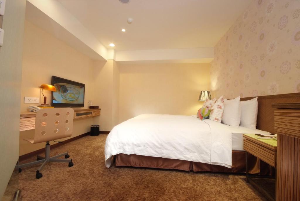 Postel nebo postele na pokoji v ubytování NAGAHIRO Hotel