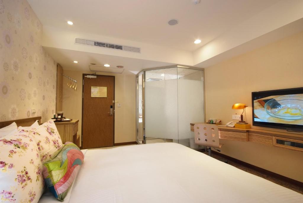 Postel nebo postele na pokoji v ubytování NAGAHIRO Hotel