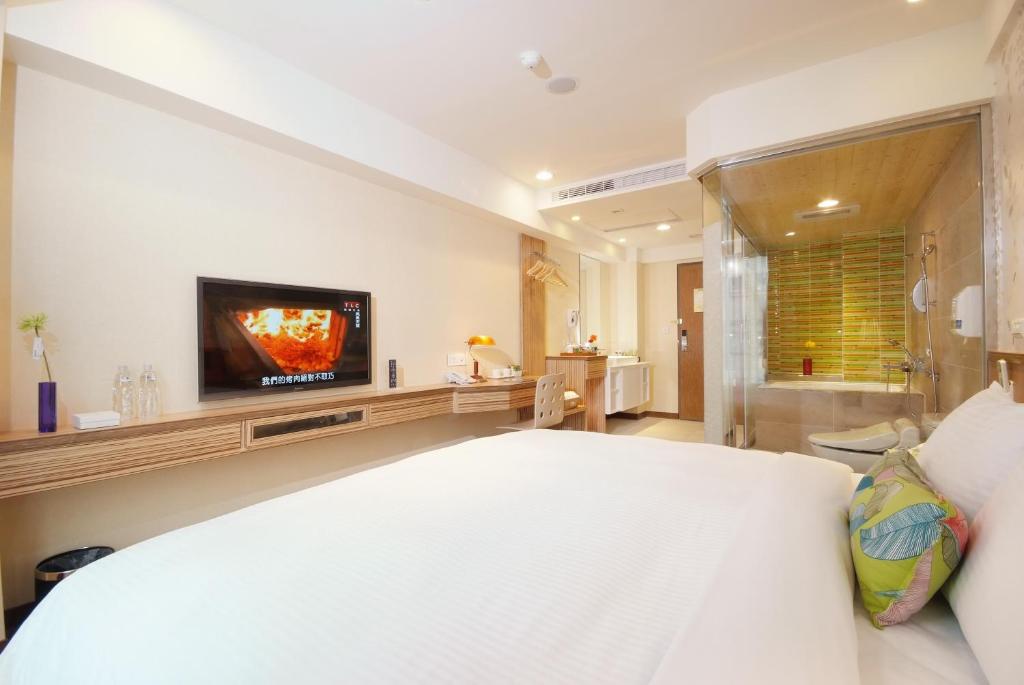 Postel nebo postele na pokoji v ubytování NAGAHIRO Hotel
