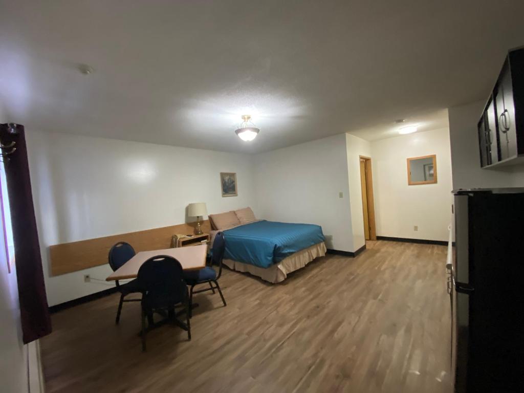 Tempat tidur dalam kamar di Mountain View Motel