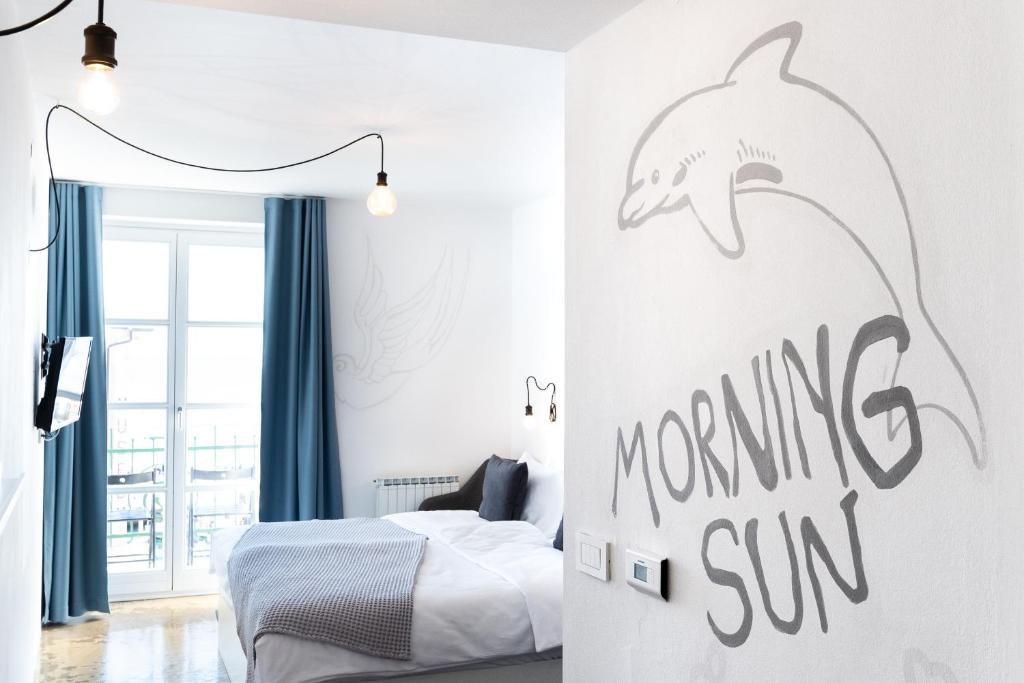Una cama o camas en una habitación de Art Hotel Tartini