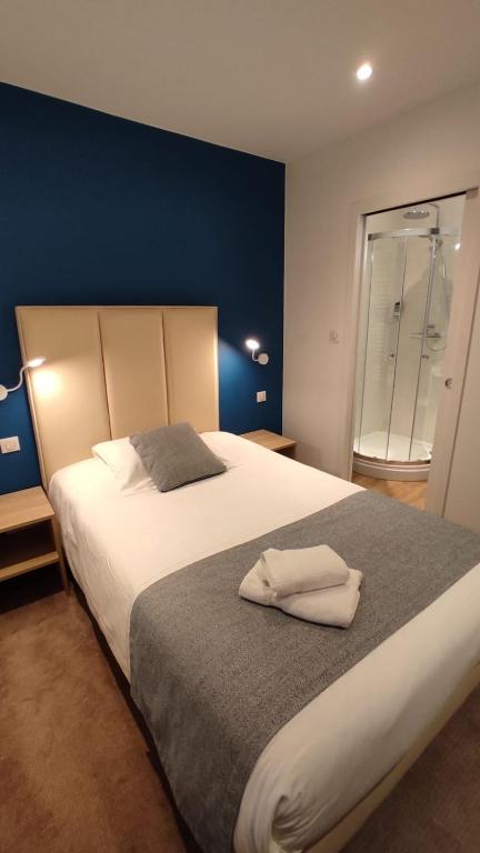 Postel nebo postele na pokoji v ubytování Hôtel Villa Des 2 Caps