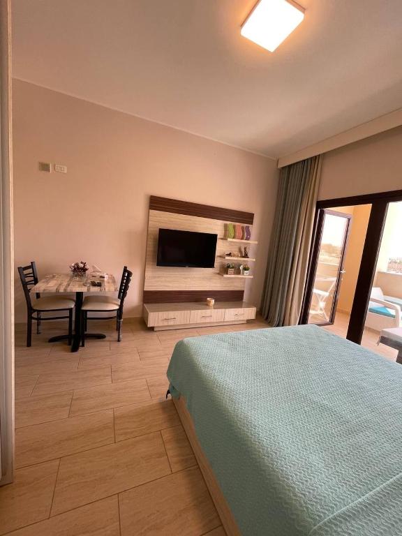 A television and/or entertainment centre at AlDau Heights Apartments