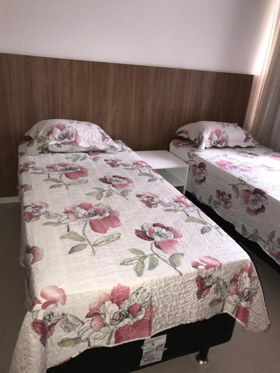 Postel nebo postele na pokoji v ubytování Residencial Ykutiba