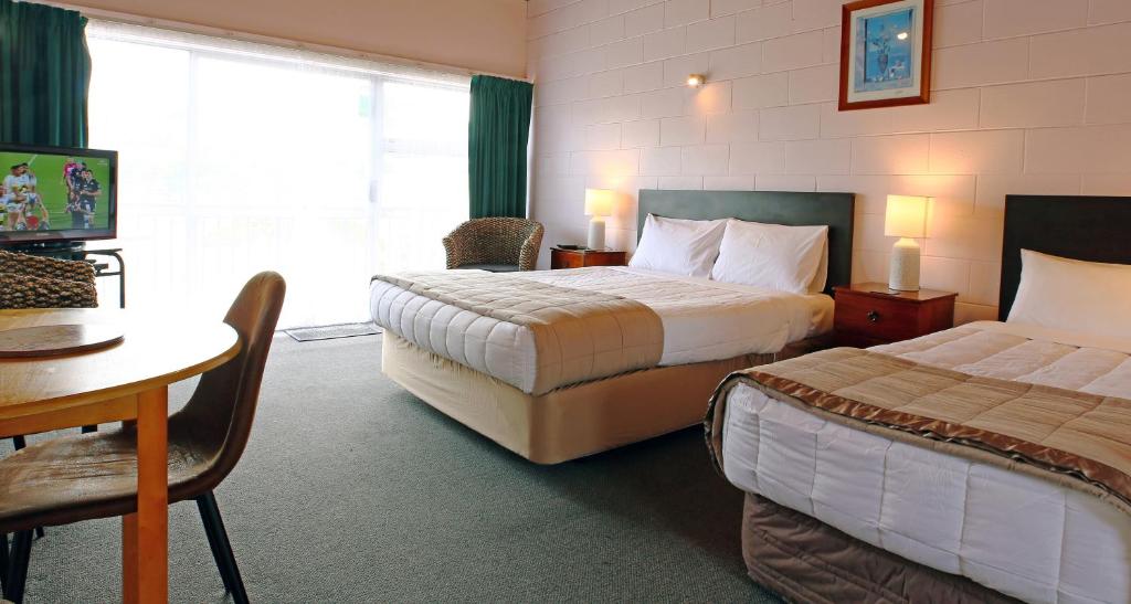 Postel nebo postele na pokoji v ubytování 289 Midway Motel
