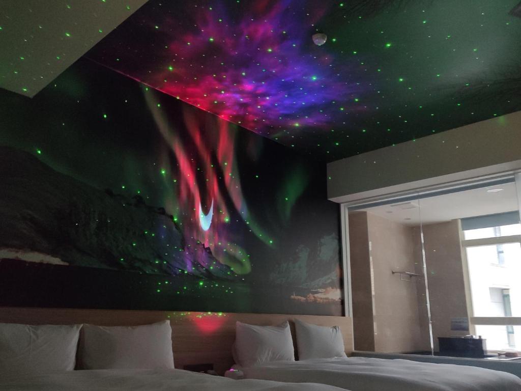 Postel nebo postele na pokoji v ubytování Muen Yuan Dong Hot Spring Hotel