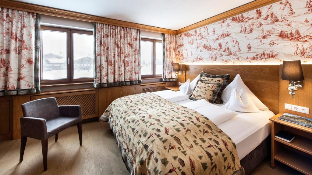 Postel nebo postele na pokoji v ubytování Hotel & Chalet Montana