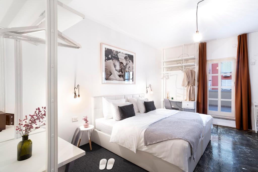 Una cama o camas en una habitación de Art Hotel Tartini