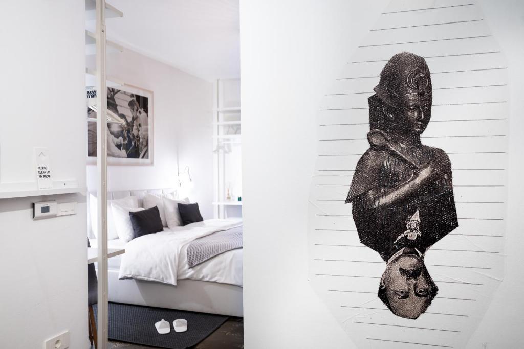 Una cama o camas en una habitación de Art Hotel Tartini