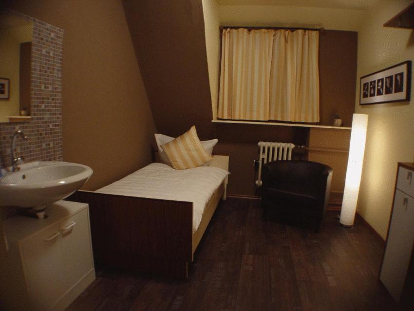 Postel nebo postele na pokoji v ubytování Hotel Palatino