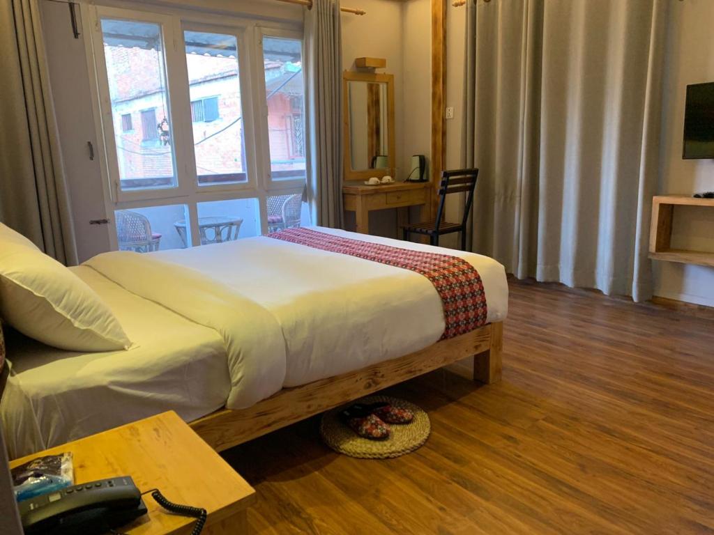 Postel nebo postele na pokoji v ubytování Silu Homes by Hostmandu
