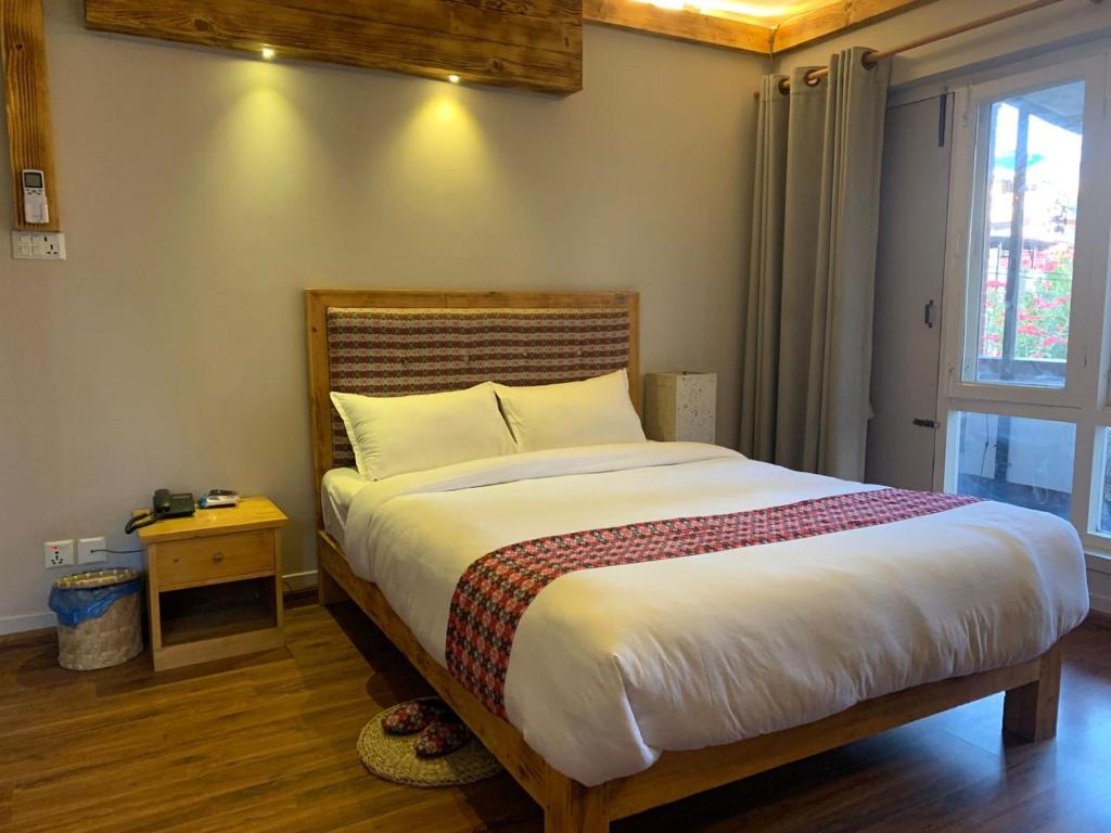 Postel nebo postele na pokoji v ubytování Silu Homes by Hostmandu