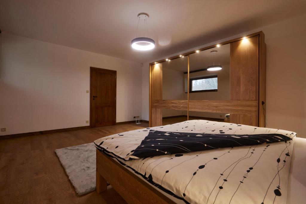 Postel nebo postele na pokoji v ubytování Apartmány na Krásné Vyhlídce