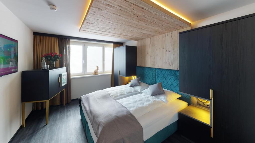 Posteľ alebo postele v izbe v ubytovaní Hotel Panther'A