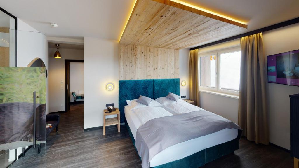 Posteľ alebo postele v izbe v ubytovaní Hotel Panther'A
