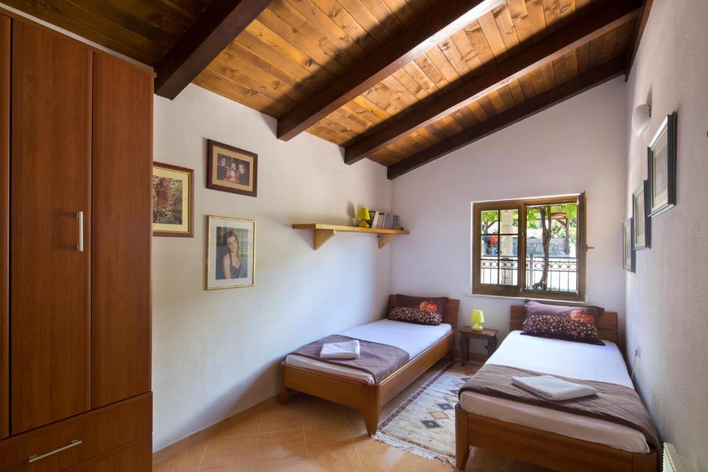 Postel nebo postele na pokoji v ubytování Villa Robinson