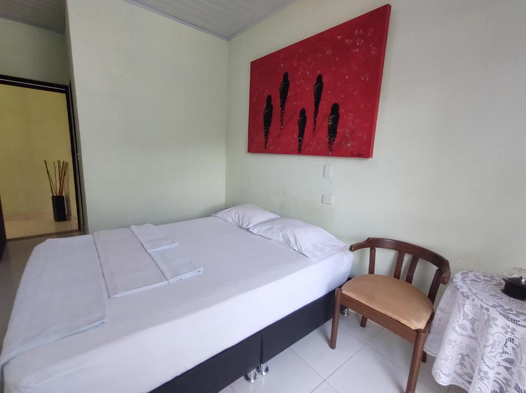Postel nebo postele na pokoji v ubytování Hospedaje Alto de San Luis - Vivienda Turística RNT-90280