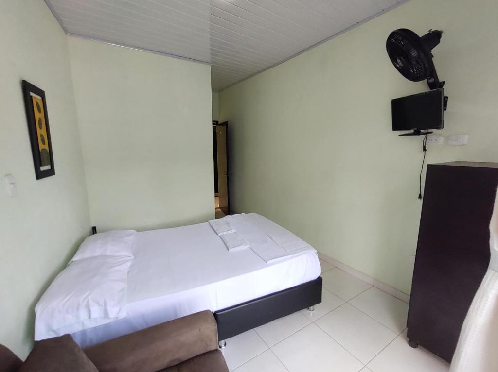 Postel nebo postele na pokoji v ubytování Hospedaje Alto de San Luis - Vivienda Turística RNT-90280