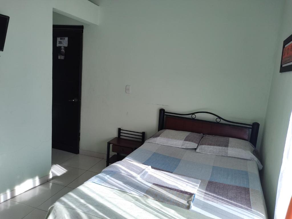 Postel nebo postele na pokoji v ubytování Hospedaje Alto de San Luis - Vivienda Turística RNT-90280