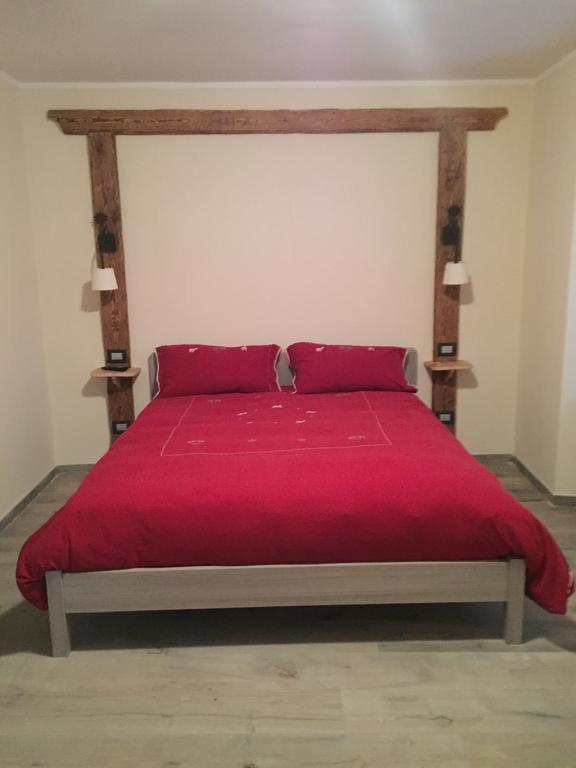 A bed or beds in a room at La Boule de Neige