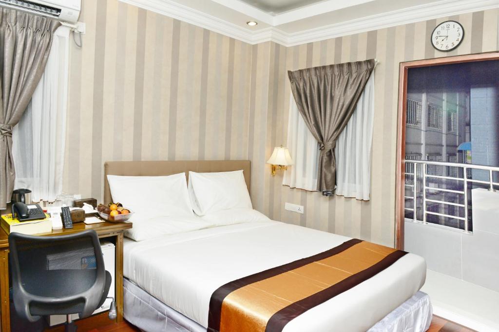 Postel nebo postele na pokoji v ubytování Hotel Grand United - 21st Downtown