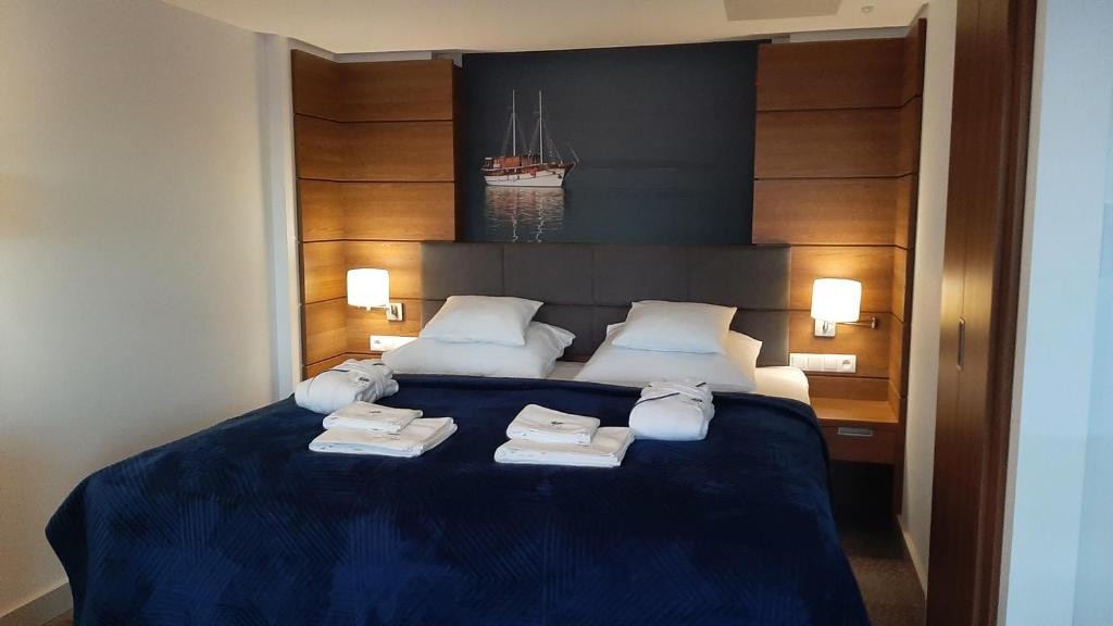 Łóżko lub łóżka w pokoju w obiekcie Hotel SKAL Medi SPA & Resort