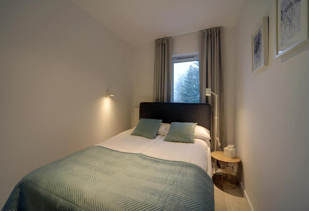 Posteľ alebo postele v izbe v ubytovaní Apartament Źródlana Ski 300M