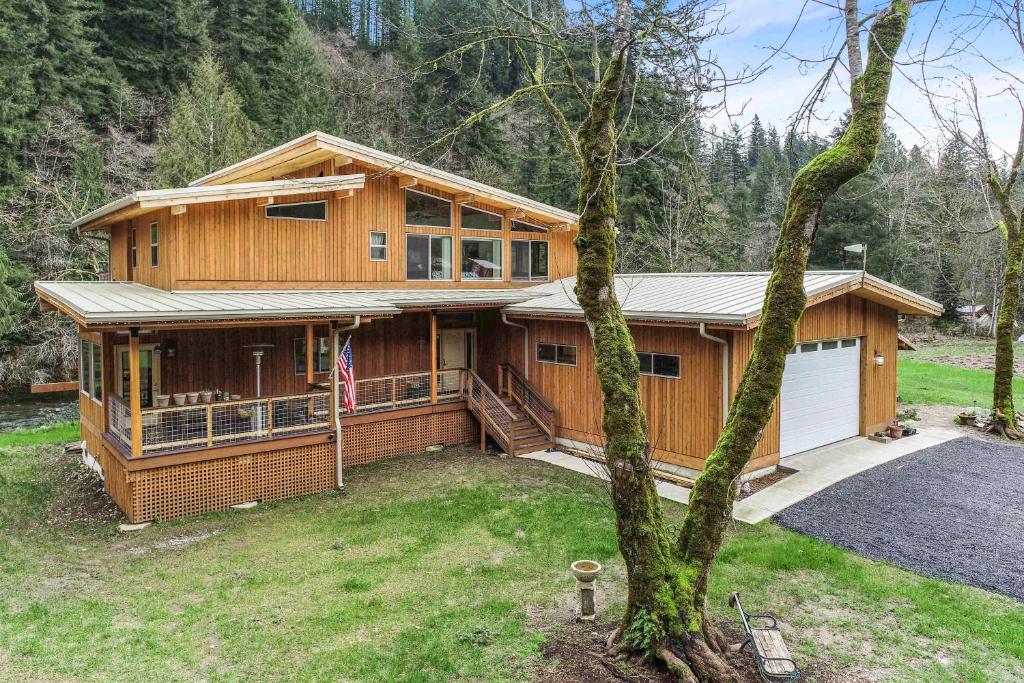 a large wooden house with a garage at Angels Rest B&B Lavender Farm in Skamania