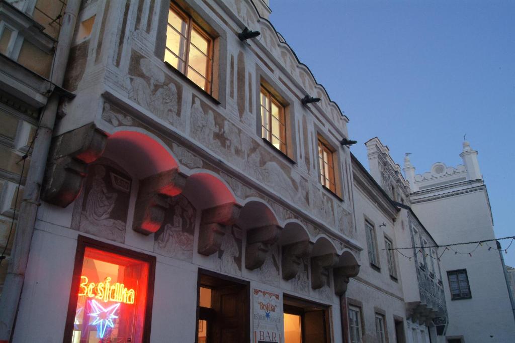 a building with a sign on the side of it at Besidka in Slavonice