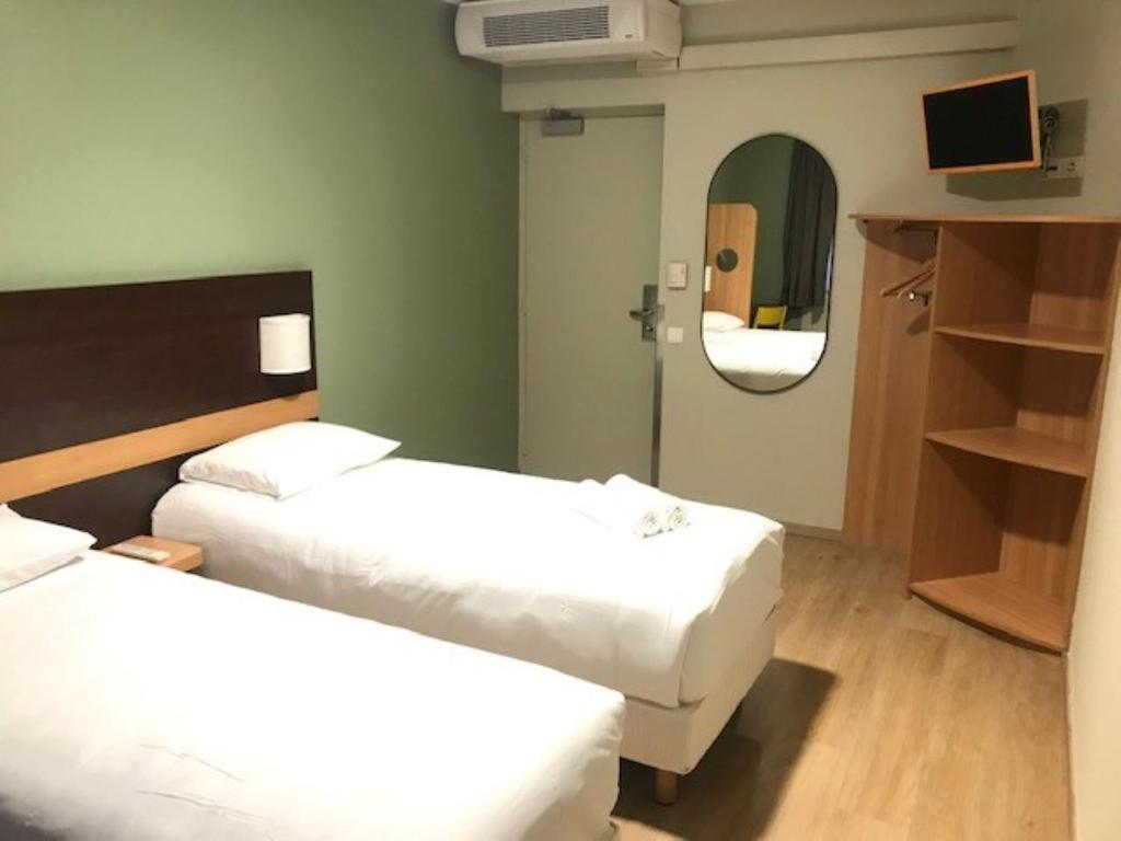 Postel nebo postele na pokoji v ubytování Vini Hotel