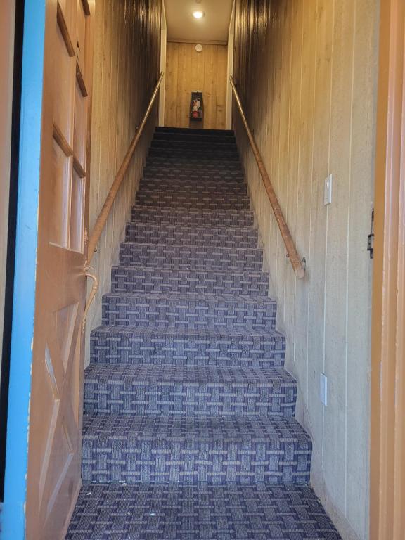 a flight of stairs in a building at Townhouse Motel in Bishop