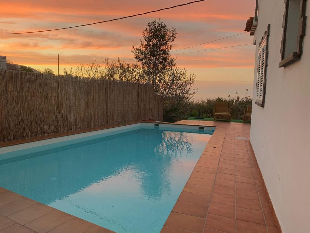 a swimming pool in the backyard of a house at El Cercado in Icod de los Vinos