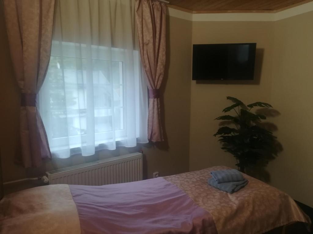 Postel nebo postele na pokoji v ubytování Pension Krista